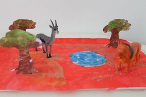 décor en peinture pour jouer avec des figurines de la savane