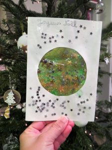 Carte de voeux ou de Noël en transparence avec paillettes